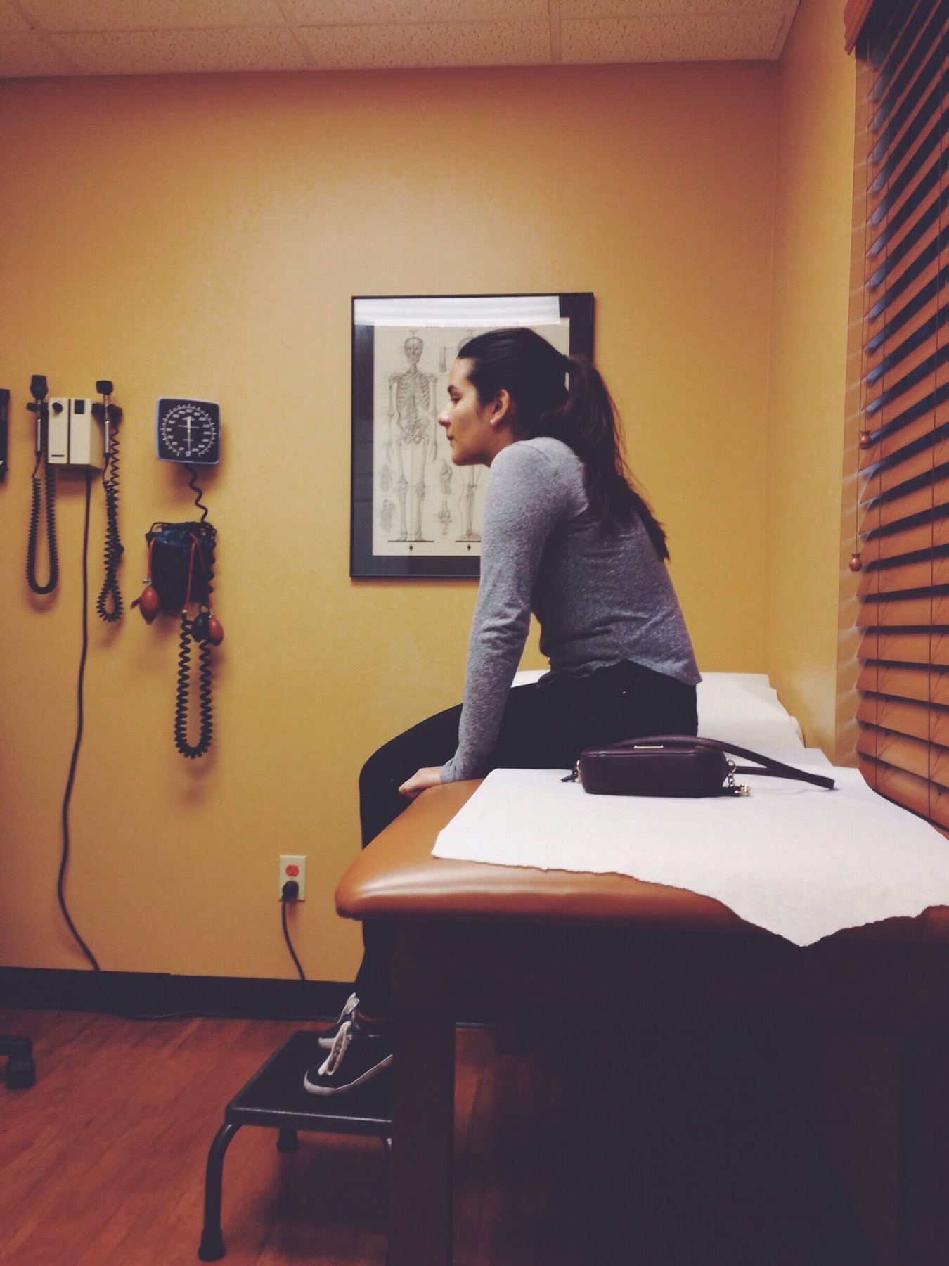 girl sitting in a doctors office