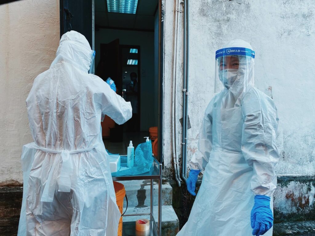 Healthcare workers in full PPE (personal protective equipment)