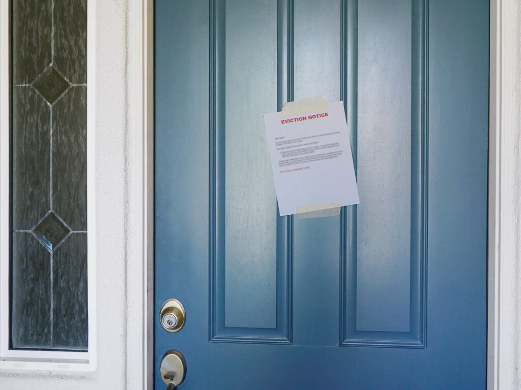 An eviction notice taped to the front door of a home