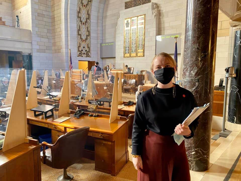 Nebraska State Senator Megan Hunt in Nebraska State Capitol wearing mask