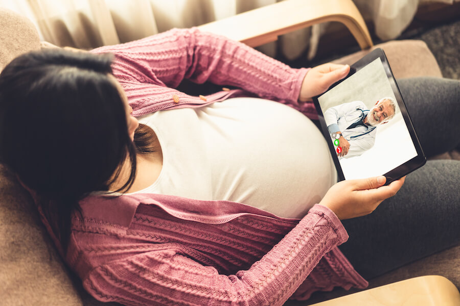 Pregnant person at telemedicine appointment