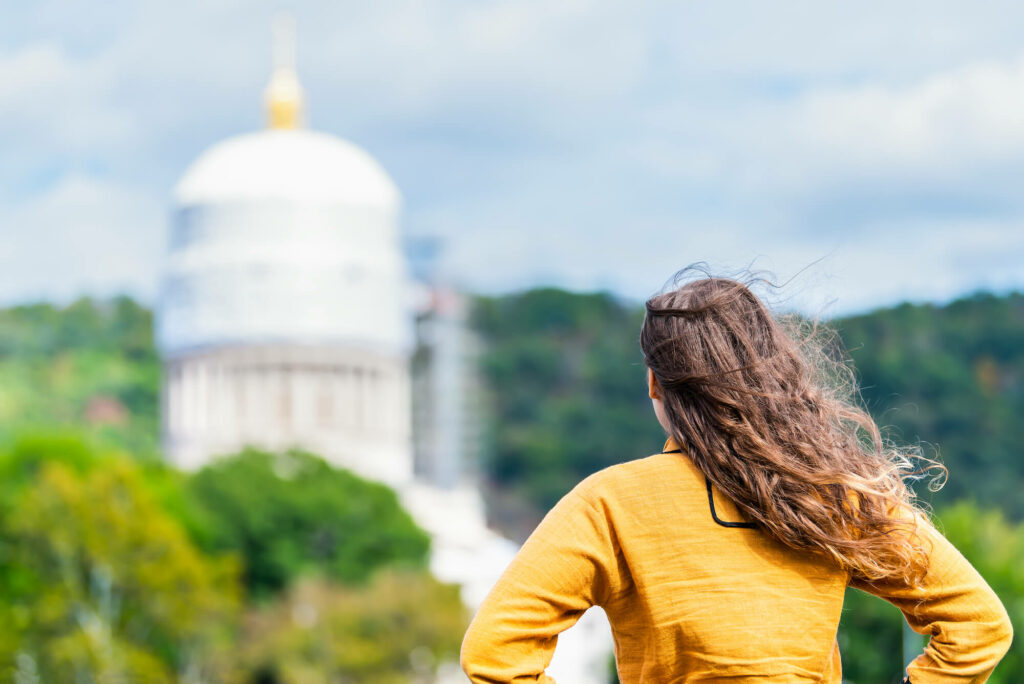 Person looking at west virginia capitol dome in the distance