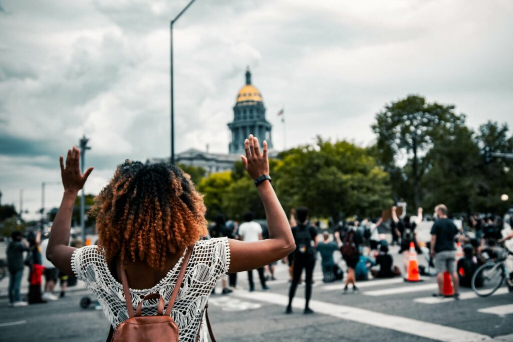 colin lloyd hands raised colorado state capitol