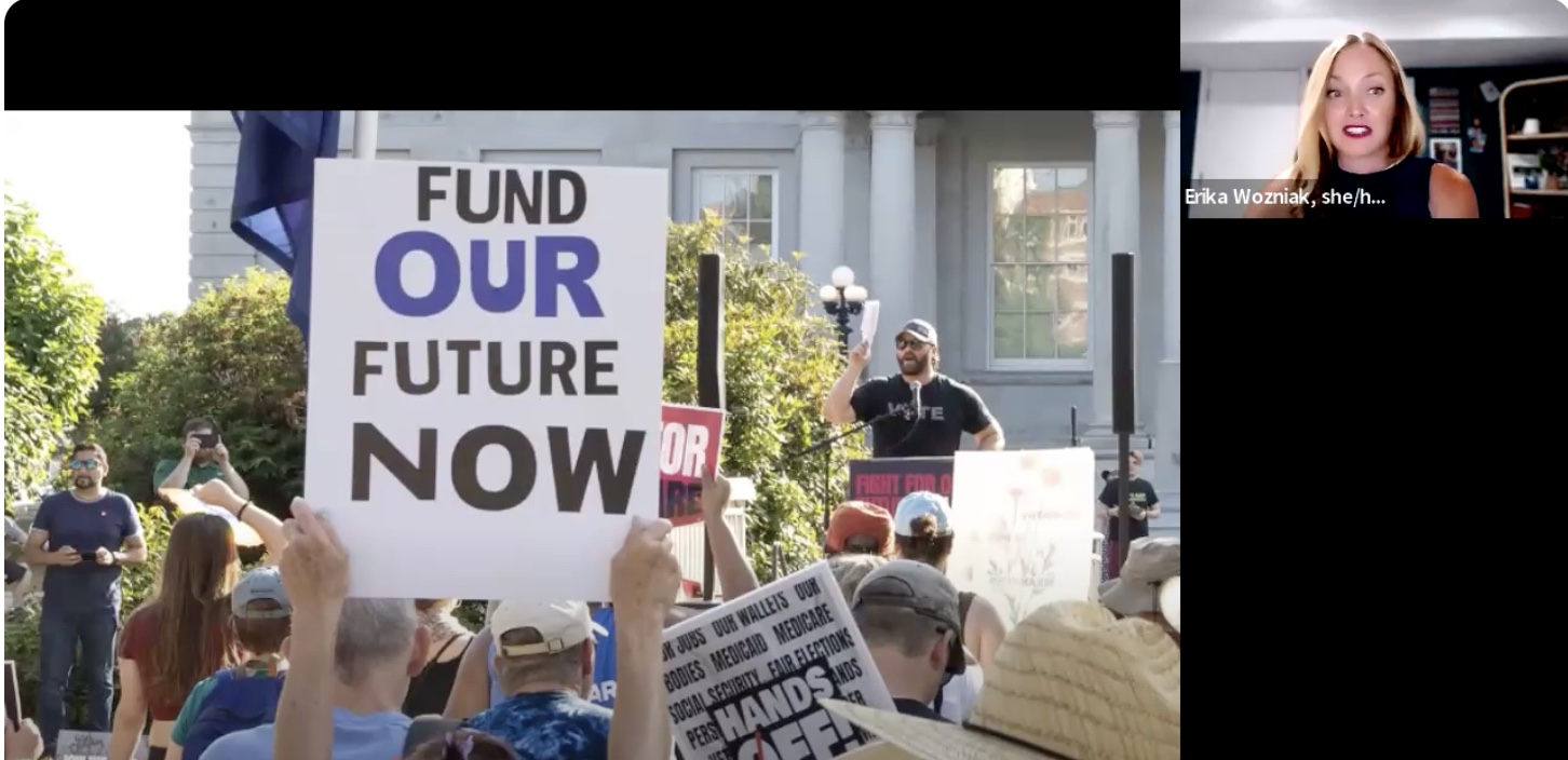 Screenshot from the Funding Our Futures: Tax Justice Initiative webinar. Erika Wozniak's image is in the right corner. Image at the center is of a rally, where the sign "FUND OUR FUTURS NOW" is prominently featured.