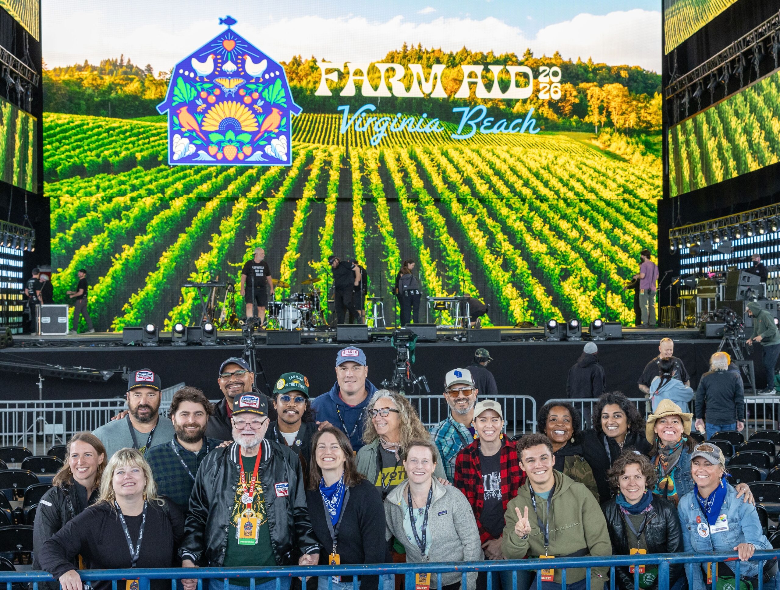 Group pictures of CROP legislators and SiX staff in front of the Farm Aid stage