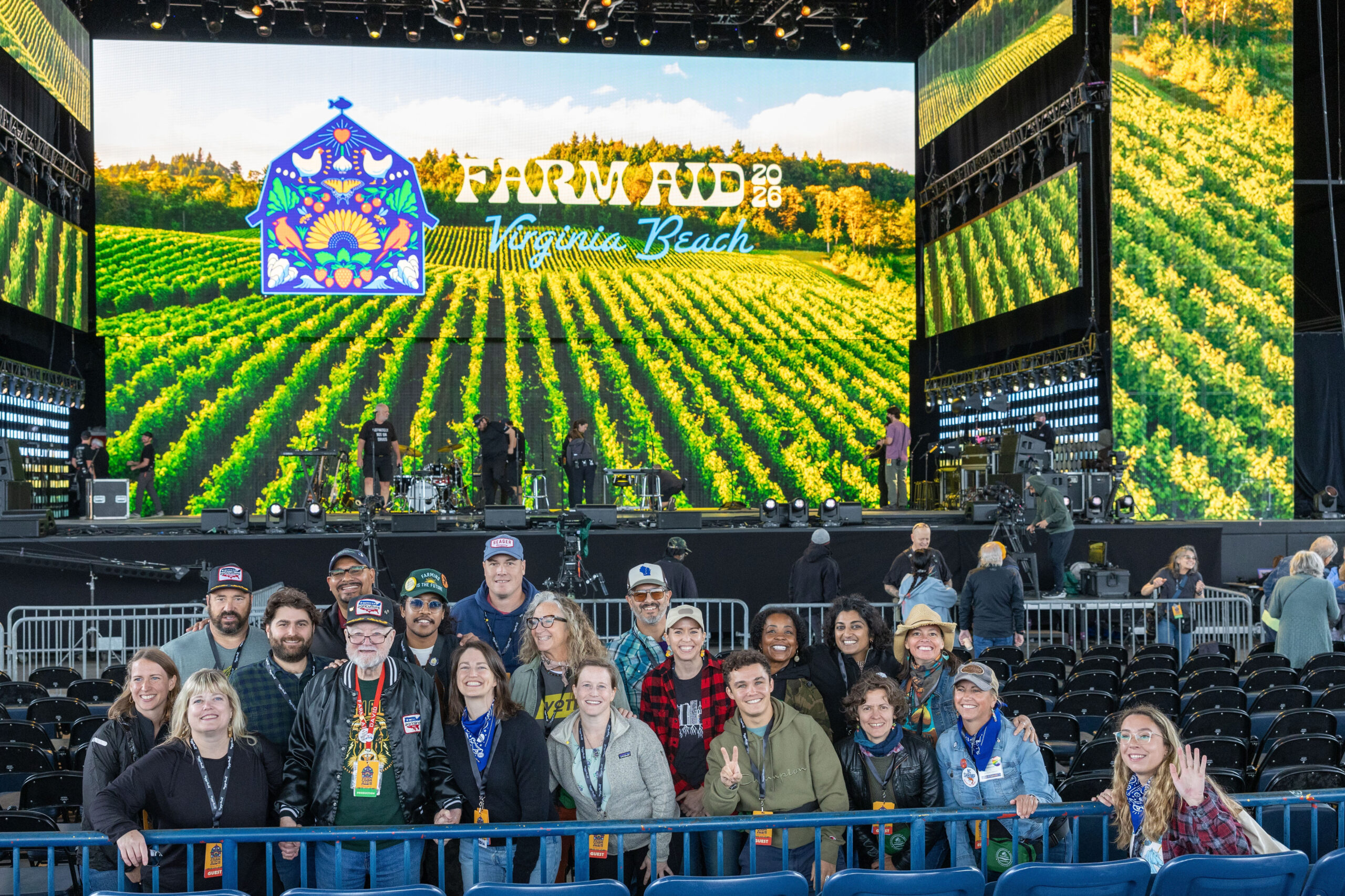 Group pictures of CROP legislators and SiX staff in front of the Farm Aid stage